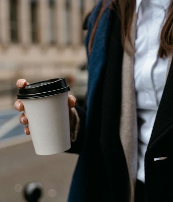 Woman feeling energized and full of life in a bright, spacious room.
